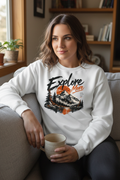 Woman relaxing at home in a white Explore More printed fleece sweatshirt